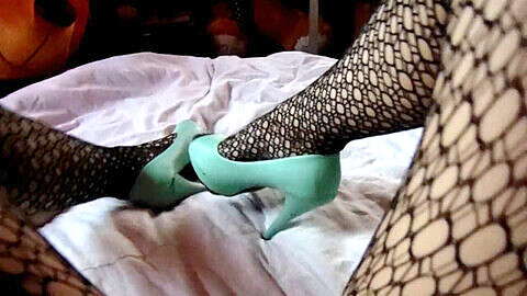 Kinky amateur teen in tights, fishnets and high heels indulges in homemade foot fetish play