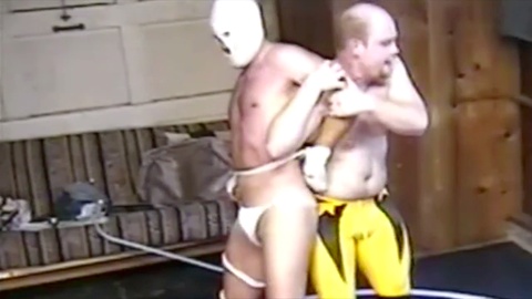 Gay masked wrestler, restrained, masked wrestler