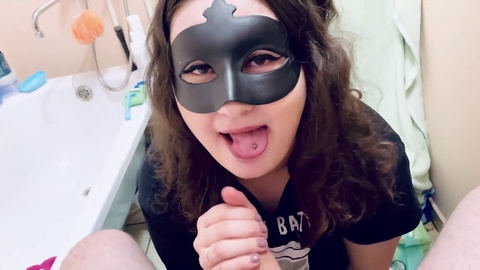 Helga wears mask while giving a sloppy blowjob, sperm dripping onto her hand and all over her big tits!