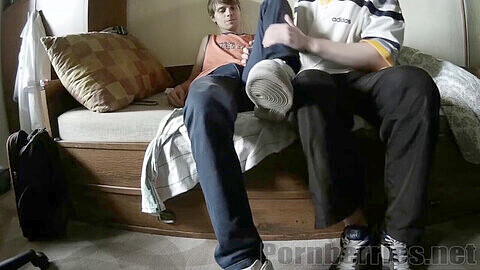 Classic feetjob with sneakers, socks, and bare soles, starring young and inexperienced gay twink