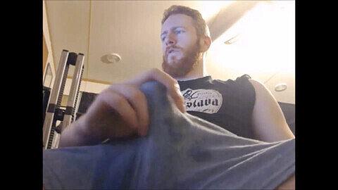 Bearded muscular ginger guy shoots a thick stream of cum