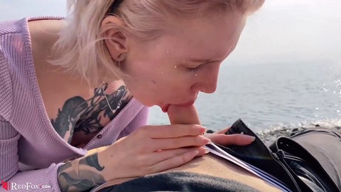 Blonde teen gives handjob and blowjob in public outdoor setting