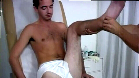 Young man undergoes physical examination with his doctor and high school gay physical