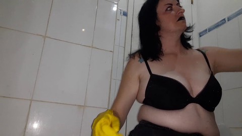 Cleaning lady, in the bathroom, on her knees