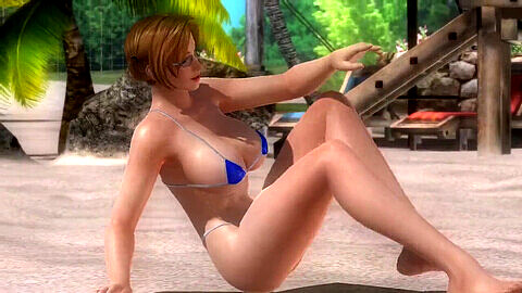 Tina from Dead or Alive 5 pole dances on the beach in stunning outfits