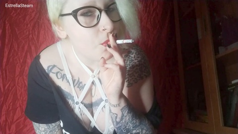 Smoking fetish video: Watch me stare into your eyes as I puff on my cigarette wearing glasses and with blue eyes