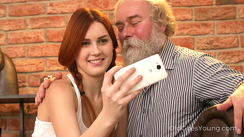 Old Goes Young: Cute ginger teen gets off while posing for pics with old man