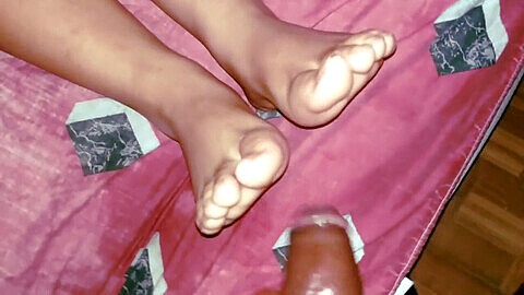 Ebony footjob with cum across my oily soles and long toenails