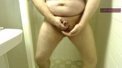 Hairy otter shoots his load and pees in the shower!
