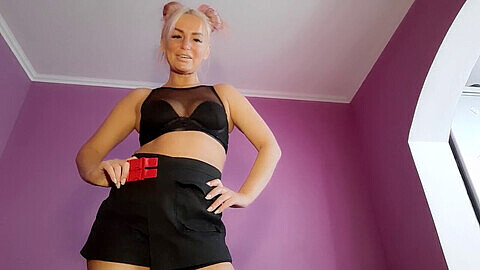 Russian dominatrix in high-heeled shoes dominates her submissive puppet and demands his release