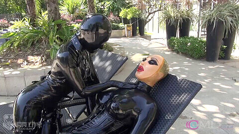 Female mask, video, glirs inflatable rubber suit