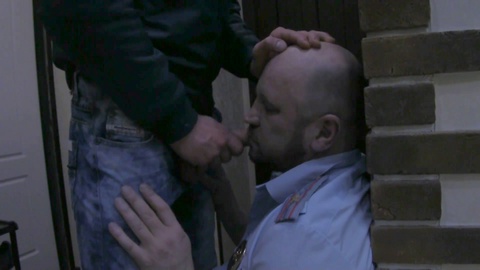 Dominant skinhead from the edge brutally throat fucks a policeman with his massive cock - part two