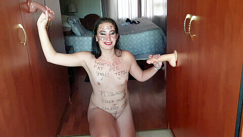 Naughty bitch covered in body writing craves the pleasure of multiple hard cocks