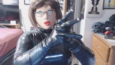 Brenda, the RubberDoll, gives her rubber attire a shiny makeover!