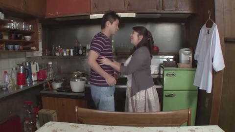 Japanese step-mother fucks in the kitchen