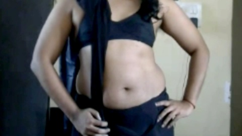 Krithi seduces in a black saree while teasing her incredible belly button - Indian crossdresser at their finest!