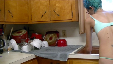 Naughty MILF Willamina masturbates with kitchen sponge vibrator and pees while doing the dishes