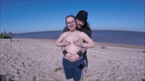 Adorable teen enjoys beach breeze while revealing it all